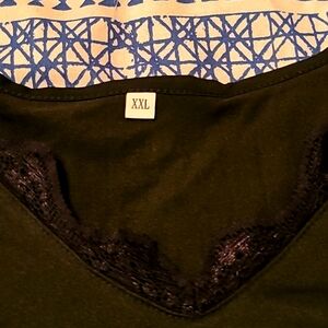 Block XXL With a cold shoulder situation and With a V neckline.